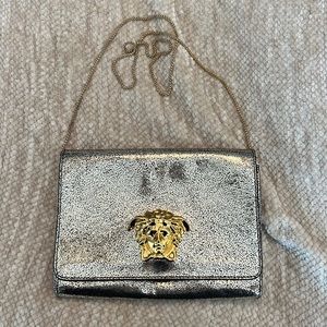 Gold Versace clutch with chain